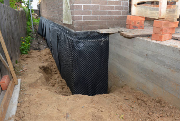 SJ Waterproofing Pros technician performing targeted Waterproofing assessment in Fremont, MI